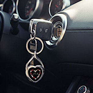Black metal keychain with a pink and red heart