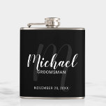 Black Modern Script Personalized Groomsmen Hip Flask<br><div class="desc">Add a personal touch to your wedding with personalized groomsmen flask. This flask features personalized groomsmen's name in white modern script font style and monogram in light grey modern script font style as background with title and wedding date in white modern sans serif font style on black background. Also perfect...</div>