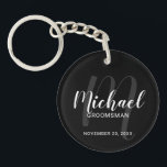 Black Modern Script Personalized Groomsmen Keychain<br><div class="desc">Add a personal touch to your wedding with personalized groomsmen keychain. This keychain features personalized groomsmen's name in white modern script font style and monogram in grey modern script font style as background with title and wedding date in white modern sans serif font style on black background. Also perfect for...</div>