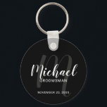 Black Modern Script Personalized Groomsmen Keychain<br><div class="desc">Add a personal touch to your wedding with personalized groomsmen keychain. This keychain features personalized groomsmen's name in white modern script font style and monogram in grey modern script font style as background with title and wedding date in white modern sans serif font style on black background. Also perfect for...</div>