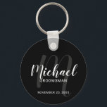 Black Modern Script Personalized Groomsmen Keychain<br><div class="desc">Add a personal touch to your wedding with personalized groomsmen keychain. This keychain features personalized groomsmen's name in white modern script font style and monogram in grey modern script font style as background with title and wedding date in white modern sans serif font style on black background. Also perfect for...</div>