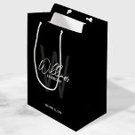 Black Modern Script Personalized Groomsmen Medium Gift Bag<br><div class="desc">Modern Minimalist Personalized Monogram and Name Gifts This design features personalized name in white modern handwriting script font style and monogram in grey modern sans serif font style as background, with wedding details in white modern sans serif font style, on black background. Also perfect for best man, maid of honour,...</div>