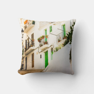 BLACK MOTORCYCLE NEAR WHITE WALL BUILDING AT DAYTI THROW PILLOW