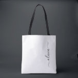 Black Name White Girly Script Monogram Modern Tote Bag<br><div class="desc">Black and White Elegant Add Your Own Name Monogram Book Bag. This Book Bag can be customized to include your initial and first name and given as a gift for Christmas,  Sweet 16 Birthday,  Bridal Shower or a Wedding.</div>
