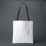 Black Name White Girly Script Monogram Modern Tote Bag<br><div class="desc">Black and White Elegant Add Your Own Name Monogram Book Bag. This Book Bag can be customized to include your initial and first name and given as a gift for Christmas,  Sweet 16 Birthday,  Bridal Shower or a Wedding.</div>