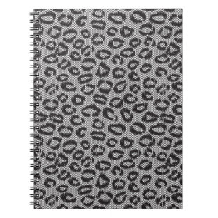 Black net lace with leopard pattern on white notebook