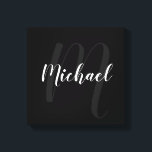 Black personalized Monogram and Name Canvas Print<br><div class="desc">Personalized Monogram and Family Name Gift
featuring name in white modern script font style and monogram in grey modern script font style as background on black background.</div>