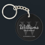 Black Personalized Script Groomsmen name&Monogram  Keychain<br><div class="desc">Add a personal touch to your wedding with personalized groomsmen keychain. This keychain features personalized groomsman's name in white classic script font style with wedding details in white classic serif font style and monogram in grey classic serif font style as background, on black background. Also perfect for best man, father...</div>