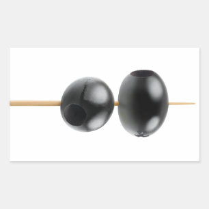 Black pitted olives on a skewer sticker