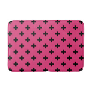 Black polka crosses on fuchsia bath mat
