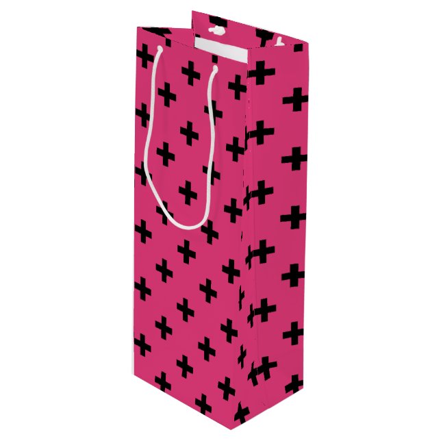Black polka crosses on fuchsia wine gift bag (Front Angled)