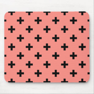 Black polka crosses on peach mouse pad