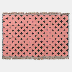 Black polka crosses on peach throw blanket