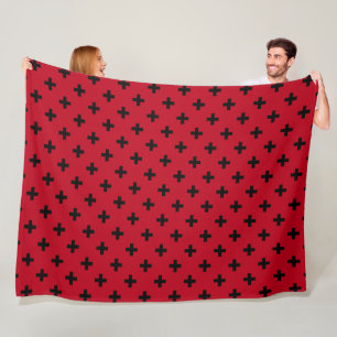 Black polka crosses on red fleece blanket