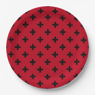 Black polka crosses on red paper plate