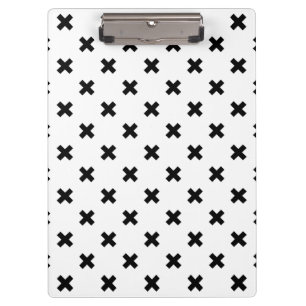 Black polka crosses on white clipboard