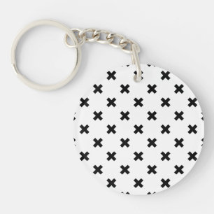 Black polka crosses on white keychain