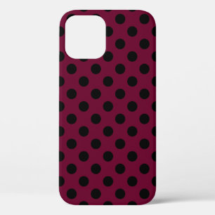 Black polka dots on burgundy iPhone 12 case
