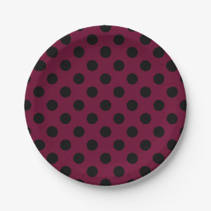 Black polka dots on burgundy paper plate