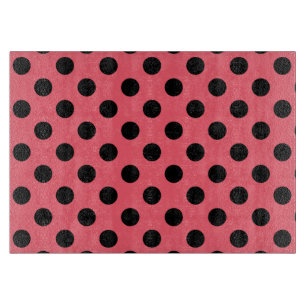 Black polka dots on coral cutting board
