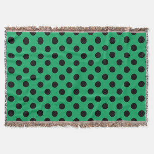 Black polka dots on fresh green throw blanket