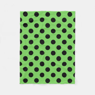 Black polka dots on lime green fleece blanket