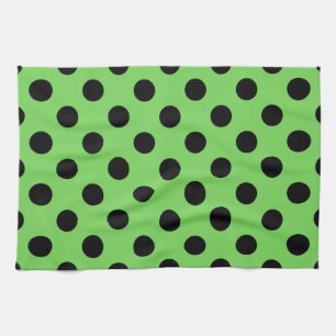 Black polka dots on lime green kitchen towel
