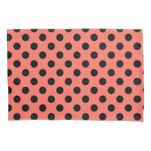 Black polka dots on living coral pillowcase
