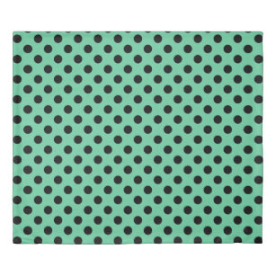 Black polka dots on mint green duvet cover