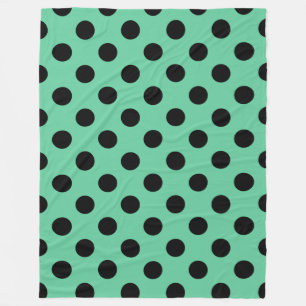 Black polka dots on mint green fleece blanket