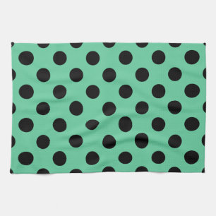Black polka dots on mint green kitchen towel