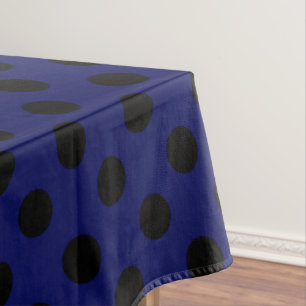 Black polka dots on navy blue tablecloth