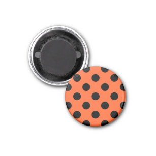 Black polka dots on orange magnet