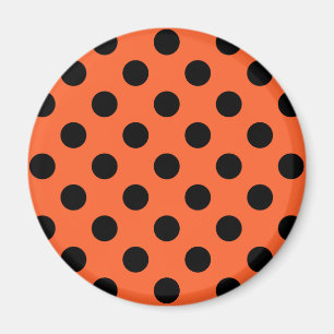 Black polka dots on orange magnet