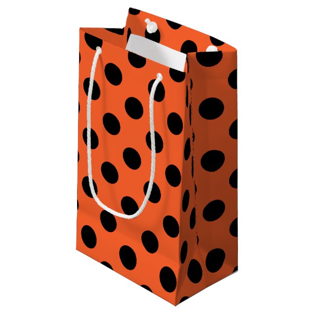 Black polka dots on orange small gift bag (Front Angled)
