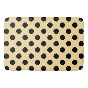 Black polka dots on pale yellow bath mat