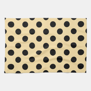 Black polka dots on pale yellow kitchen towel