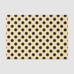 Black polka dots on pale yellow tissue paper
