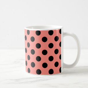 Black polka dots on peach coffee mug