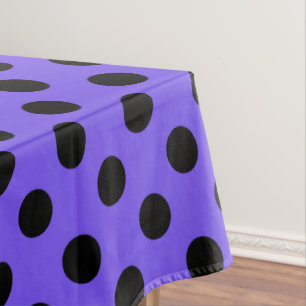 Black polka dots on periwinkle tablecloth
