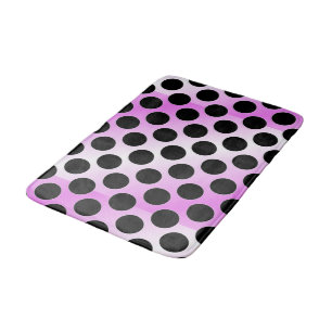 Black polka dots on pink bath mat