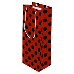 Black polka dots on red wine gift bag
