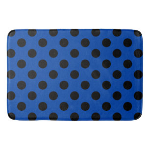 Black polka dots on royal blue bath mat