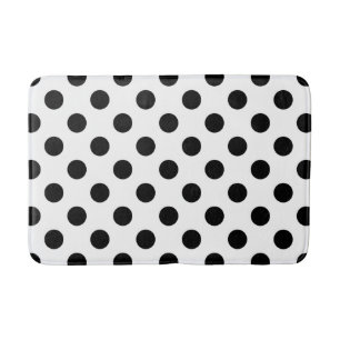 Black polka dots on white bath mat