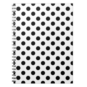 Black polka dots on white notebook