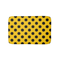 Black polka dots on yellow