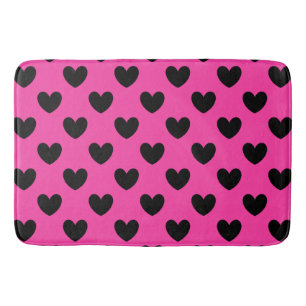 Black polka hearts on fuchsia pink bath mat