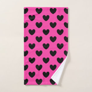 Black polka hearts on fuchsia pink hand towel