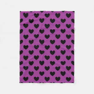 Black polka hearts on purple fleece blanket
