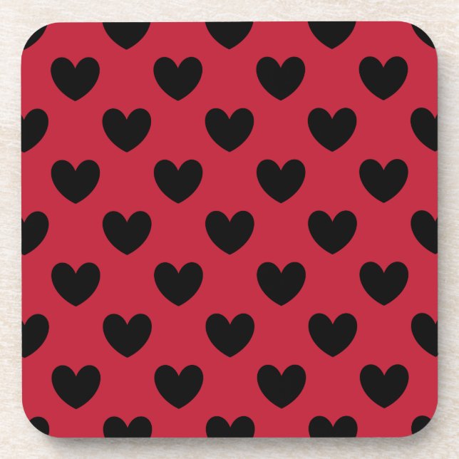 Black polka hearts on red coaster (Front)
